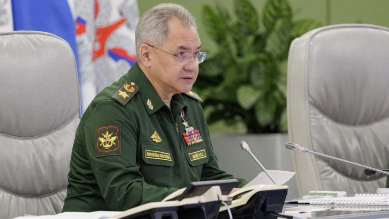 Russian Defense Minister Sergey Shoigu speaks in uniform during a conference