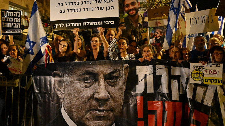 Israeli protesters call for the resignation of Prime Minister Benjamin Netanyahu outside his residence in Jerusalem