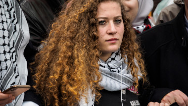 London, UK. 1th May 2019. Palestinian teenage activist Ahed Tamimi holds the banner at the front of the march from the BBC to a rally in Whitehall a few days before Nakba day showing solidarity with the Palestinian people and opposing continued Israel vio