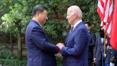 Joe Biden shake hands with President Xi Jinping