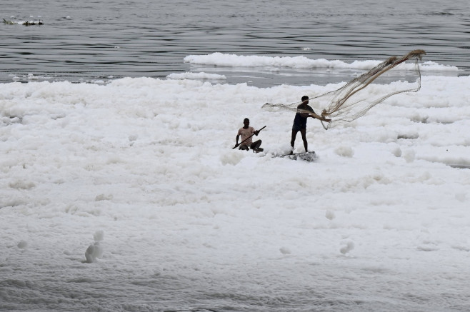 NEW DELHI, INDIA SEPTEMBER 10: After heavy rainfall Yamuna river covered with a thick layer of toxic foam due to water p