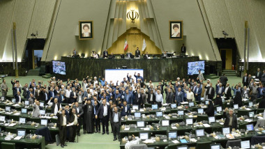 Iranian lawmakers chant the slogans ''Down with Israel'' and ''Down with the USA'' during an open session of the parliament