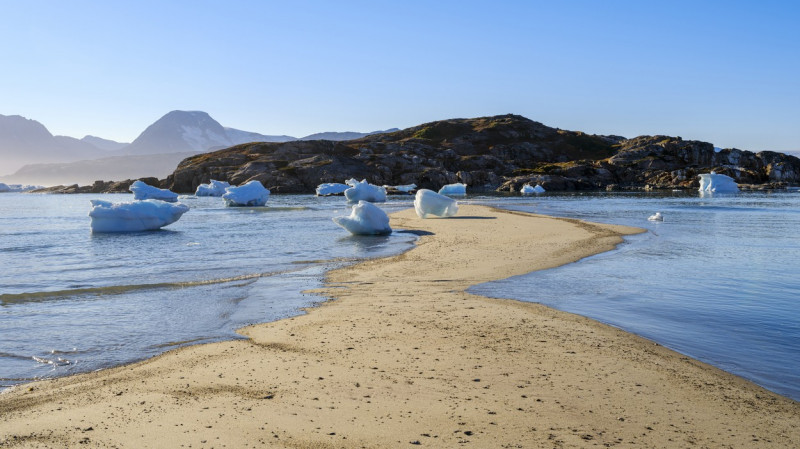 Melting ice on shore. Landscape at the Sermilik (Sermiligaaq) icefjord in the area Ammassalik in East Greenland. North America, Greenland, Ammassalik, Danish territory, autumn