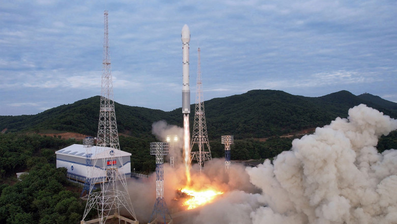 satellite-carrying rocket as it leaves the launch pad in north korea