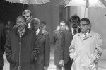 Muhammad Anwar al SADAT, also as-Sadat, State President of Egypt, and Henry KISSINGER, Foreign Minister of the USA, stand under umbrellas at a meeting with US President Gerald Ford, in Salzburg in June 1975, usage worldwide