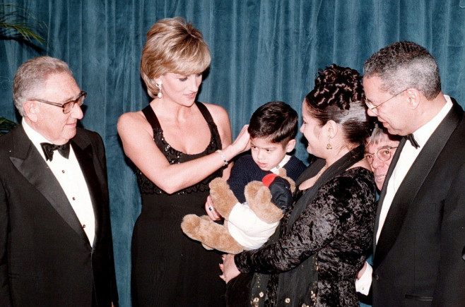 File photo dated 12/12/95 of the Princess of Wales meeting four-year-old Christopher Baretto and his mother Mariela before the Cerebral Palsy dinner in New York with (left) Dr Henry Kissinger and (right) General Colin Powell. Colin Powell, the former US J