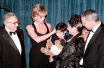 File photo dated 12/12/95 of the Princess of Wales meeting four-year-old Christopher Baretto and his mother Mariela before the Cerebral Palsy dinner in New York with (left) Dr Henry Kissinger and (right) General Colin Powell. Colin Powell, the former US J