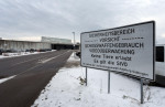 20 December 2022, Bavaria, Gablingen: In front of the Gablingen correctional facility, people point out the security area. After about two and a half years in the high-security prison in Burg, the right-wing extremist and anti-Semitic assassin from Halle