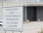 Gablingen, Germany. 30th Oct, 2018. A member of the judiciary makes a phone call at the gate of the Augsburg-Gablingen prison. The former Audi CEO Rupert Stadler was detained here on remand. Credit: Stefan Puchner/dpa/Alamy Live News