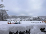 A family were forced to sleep the night in a school with his kids and 100 other motorists after heavy snow forced them to abandon their vehicles.