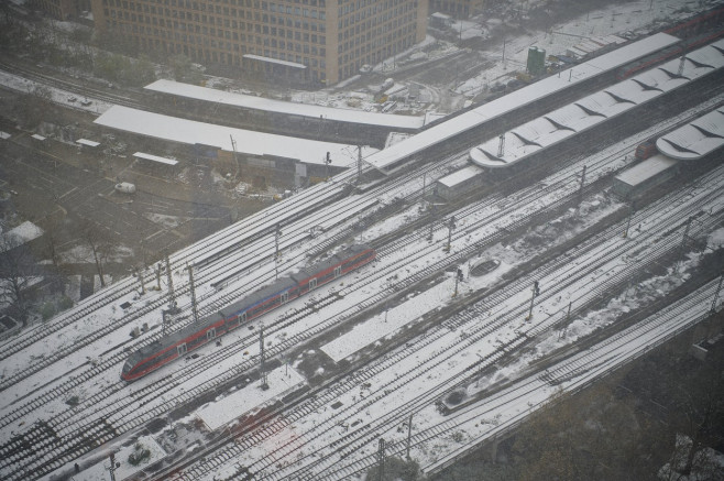 COLOGNE, GERMANY - 4 DECEMBER, 2023: Raiway station Messe Deutz during snowfall in city against sky PUBLICATIONxNOTxINxR