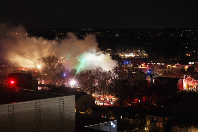 ARLINGTON, VA - DECEMBER 4: View of a fire after explosion, caused by the home owner firing a flare gun inside, as polic
