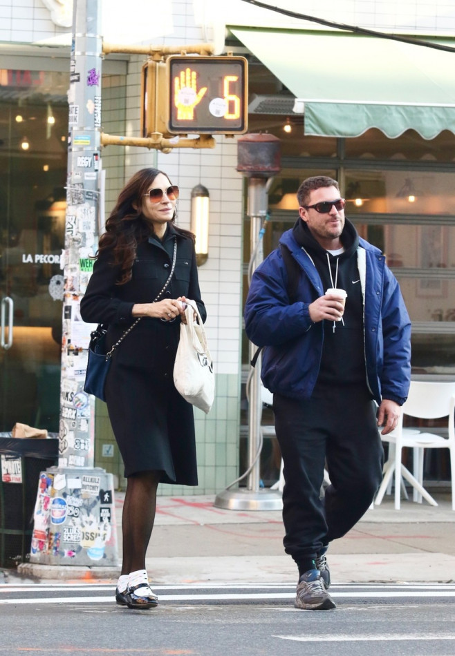 *EXCLUSIVE* Famke Janssen enjoys NYC coffee stroll with Bros star Ryan Faucett