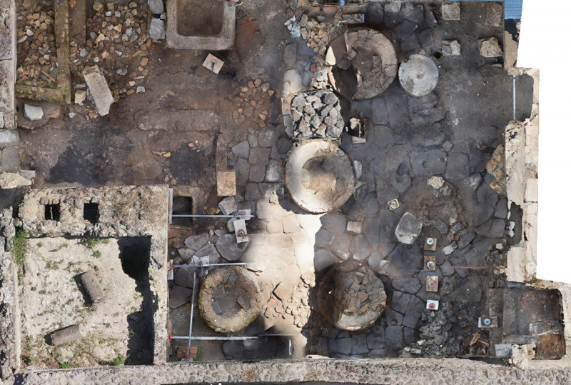 Italy, the ancient Roman city of Pompeii. Prison bakery discovered. Slaves and donkeys exploited to grind wheat for bread in a narrow room with no external view and only with small windows with iron grates for light