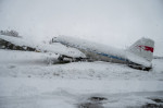 FMM, Bavaria, Germany - December 2, 2023: Onset of winter and snow chaos at the airport in Bavaria, A snowed-in airplane