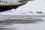 FMM, Bavaria, Germany - December 2, 2023: Onset of winter and snow chaos at the airport in Bavaria, snow plow and gritti