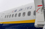 FMM, Bavaria, Germany - December 2, 2023: Onset of winter and snow chaos at the airport in Bavaria, Ryanair aircraft ful