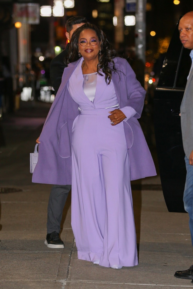 Oprah Winfrey radiant in a light purple ensemble in NYC