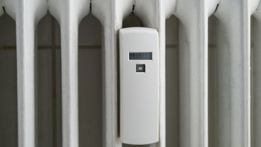 Heat cost allocator device attached to an older radiator to measure the energy consumption, copy space, selected focus