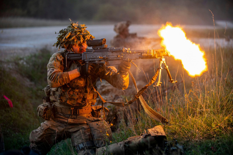 Hohenfels, Germany. 15 September, 2023. A U.S. Army soldiers with the 2nd Cavalry Regiment fires a M240 light machine gun during a gunfire battle with mock enemy forces during exercise Saber Junction 23 at the Joint Multinational Readiness Center, Septemb