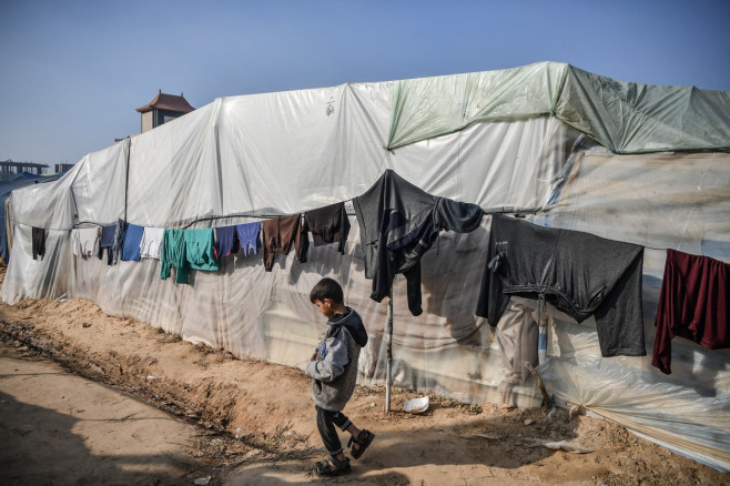 Palestinians, fleeing Israeli attacks, try to survive in makeshift tents in Rafah