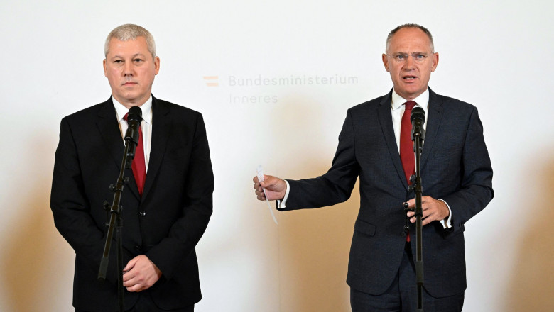 Romanian Vice-Premier and Interior Minister Catalin Predoiu (L) and Austrian Interior Minister Gerhard Karner
