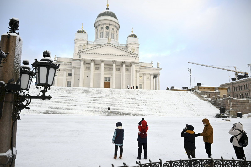 People at the Senate Square by the Helsinki Cathedral in freezing temperature in Helsinki, Finland on 3rd January, 2024.