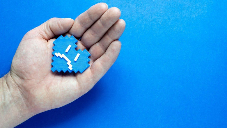 Blue Monday Concept. Hands of a man holding a blue heart.