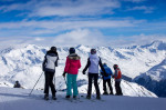 Parsenn ski resort, Davos: A group of skiers before the next descent