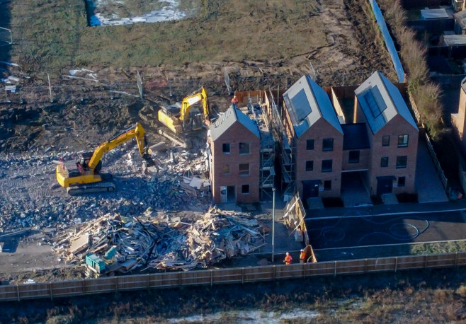 Demolition has started on over 80 houses at the Darwin Green development in Cambridge.