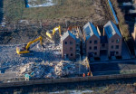 Demolition has started on over 80 houses at the Darwin Green development in Cambridge.