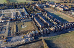 Demolition has started on over 80 houses at the Darwin Green development in Cambridge.