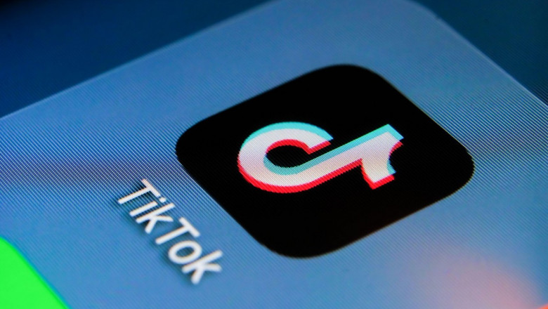 TikTok app on the smartphone screen with visible pixels. Selective focus. Macro.