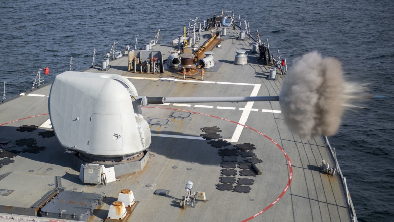 Arleigh Burke-class guided-missile destroyer USS Laboon (DDG 58) fires a round from the Mark 45, Mod 2, 5 inch gun