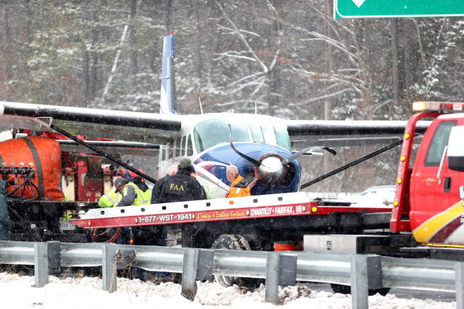 LOUDON COUNTY, PA - JANUARY 19: Emergency team on hand as a Cessna passenger plane headed for Lancaster, Pennsylvania ma