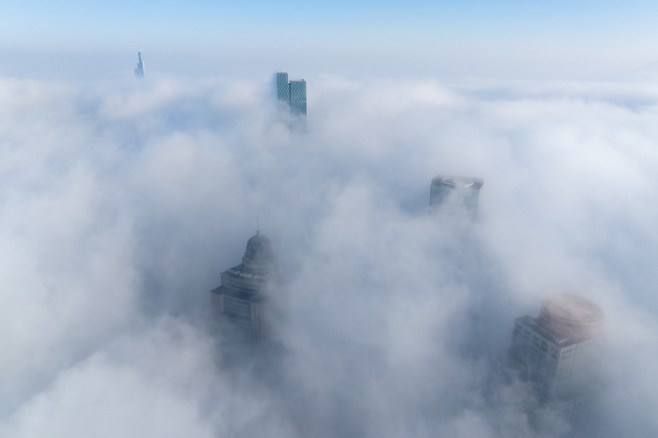 Skyscrapers Looming in Heavy Fog in Nanjing, China - 04 Jan 2024