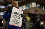 London, UK. 29th Nov, 2016. Campaigners from Global Justice Now protest outside the offices of RM Gold (Services) Ltd against CETA. In so doing, they were drawing attention to a current legal action by Gabriel Resources, a Canadian mining company, against