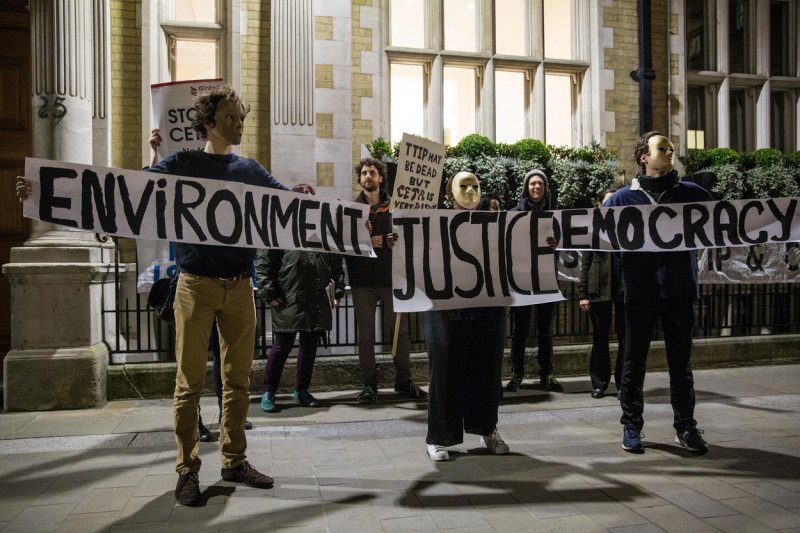 London, UK. 29th Nov, 2016. Campaigners from Global Justice Now protest outside the offices of RM Gold (Services) Ltd against CETA. In so doing, they were drawing attention to a current legal action by Gabriel Resources, a Canadian mining company, against