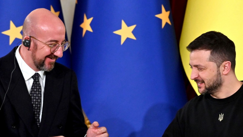 President of Ukraine Volodymyr Zelensky (R) and President of the European Council Charles Michel (L), joke during a joint press conference
