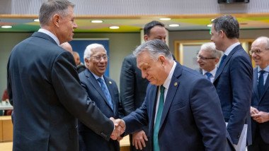 Prime Minister of Hungary Viktor Orban greets President of Romania Klaus Werner Iohannis at the round table at a scheduled EU summit