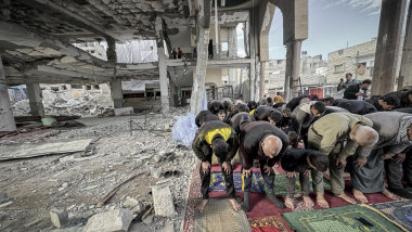 Palestinians perform prayers at Al-Huda Mosque in Rafah