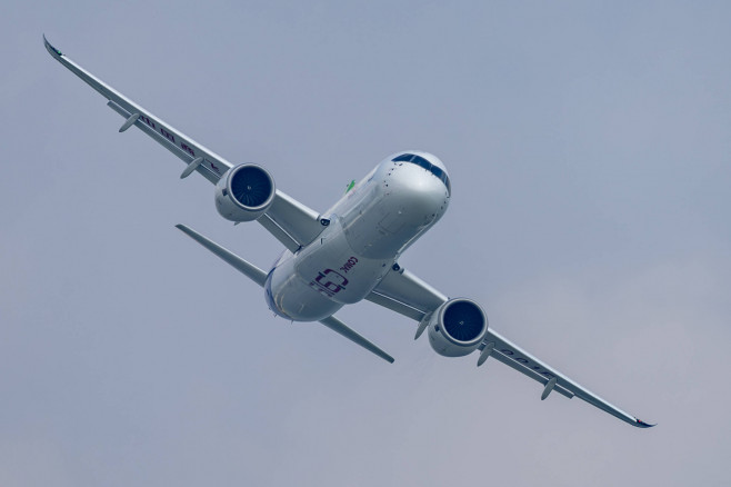 SINGAPORE, SINGAPORE - FEBRUARY 18: China s self-developed passenger jet C919 performs a rehearsal flight during a previ