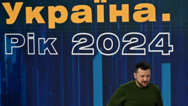 Ukraine's President Volodymyr Zelensky leaves after his press conference during the "Ukraine Year 2024" forum in Kyiv