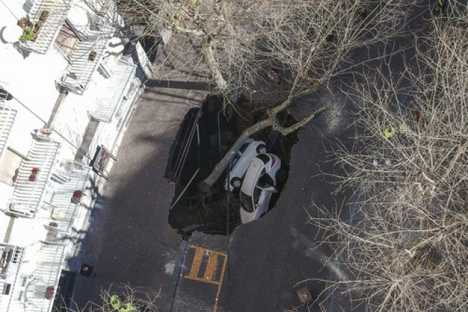Two cars engulfed by a sinkhole, San Martino Area, Vomero Neighborhood, Naples, Italy - 21 Feb 2024