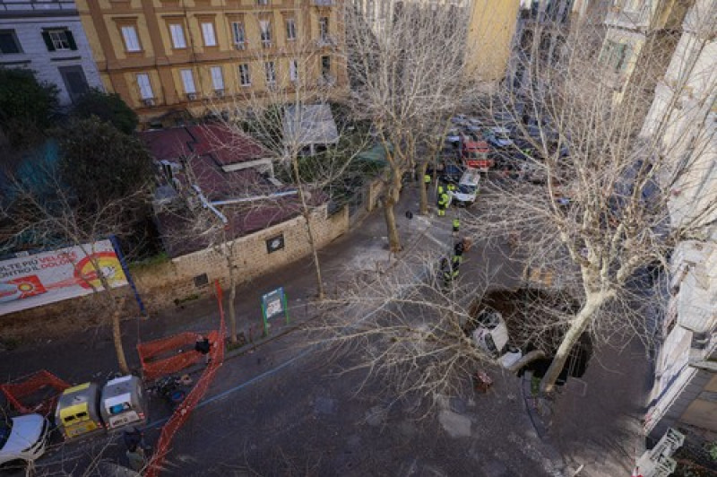 Italy, Naples: Cars swallowed by a huge sinkhole that opened up in a road in Naples's Vomero district.