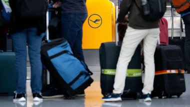 Munich, Germany. 07th Mar, 2024. Passengers wait at a Lufthansa check-in counter at Munich Airport. The Verdi trade union is paralyzing important parts of German air traffic on Thursday and Friday with renewed warning strikes by several professional group
