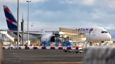 The LATAM Airlines Boeing 787 Dreamliner plane that suddenly lost altitude mid-flight a day earlier, dropping violently and injuring dozens of terrified travellers, is seen on the tarmac of the Auckland International Airport in Auckland on March 12