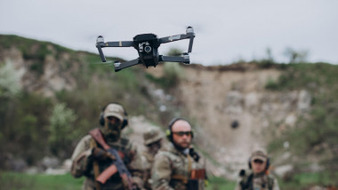 Photo of Ukrainian soldiers training with a drone