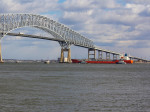 Tugs assisting tanker approaching Baltimore's Francis Scott Key Bridge (I-695)