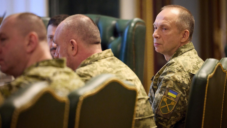 Kiev, Ukraine. 11th Feb, 2024. HANDOUT - Ukrainian Commander of the Ukraine Armed Forces Oleksandr Syrskyi, right, listens to President Volodymyr Zelenskyy during a meeting with his new military leadership team at the Mariinsky Palace, February 10, 2024 i
